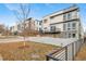 Modern townhouse exterior with private backyard and fence at 1810 Julian St # 105, Denver, CO 80204