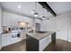 Contemporary kitchen with center island and ample counter space at 1810 Julian St # 105, Denver, CO 80204