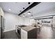 Modern kitchen with stainless steel appliances and breakfast bar at 1810 Julian St # 105, Denver, CO 80204