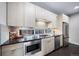Modern kitchen with stainless steel appliances and updated cabinetry at 1810 Julian St # 105, Denver, CO 80204