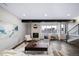 Bright living room with a fireplace, large window, and modern furnishings at 1810 Julian St # 105, Denver, CO 80204