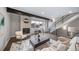Open living area with modern fireplace and ample natural light at 1810 Julian St # 105, Denver, CO 80204