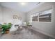 Bright office space with a modern desk, houseplant, and natural light from the window at 1810 Julian St # 105, Denver, CO 80204