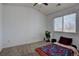 Bedroom with a ceiling fan, natural light, and comfortable furnishings at 2283 S Bannock St, Denver, CO 80223