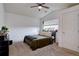 Cozy bedroom featuring a neutral color palette, a ceiling fan, and natural light at 2283 S Bannock St, Denver, CO 80223