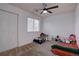 Bedroom featuring a ceiling fan and ample space for a bed and play area at 2283 S Bannock St, Denver, CO 80223