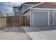 Attached garage with ample parking space and convenient access, blending practicality with home design at 2283 S Bannock St, Denver, CO 80223