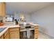Bright kitchen featuring modern appliances, light wood cabinets and a practical layout at 2283 S Bannock St, Denver, CO 80223