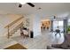 Bright, open-concept living space with hardwood floors and a seamless transition to the kitchen at 2283 S Bannock St, Denver, CO 80223