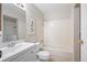 Traditional bathroom with a white vanity and shower-tub combo at 18133 E Kentucky Ave # 203, Aurora, CO 80017