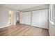 Bedroom with wood flooring and mirrored closet at 18133 E Kentucky Ave # 203, Aurora, CO 80017