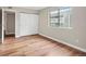 Bedroom with wood flooring and large window at 18133 E Kentucky Ave # 203, Aurora, CO 80017