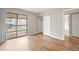 Bedroom with sliding glass door and mirrored closet at 18133 E Kentucky Ave # 203, Aurora, CO 80017
