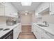 Bright, updated kitchen with white cabinets, quartz countertops, and stainless steel appliances at 18133 E Kentucky Ave # 203, Aurora, CO 80017