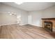Spacious living room with hardwood floors, fireplace and plenty of natural light at 18133 E Kentucky Ave # 203, Aurora, CO 80017