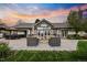 Expansive backyard features a patio with a fire pit, dining area, and lush landscaping, perfect for outdoor living at 18 Club Ln, Littleton, CO 80123