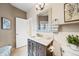 Charming bathroom with a decorative mirror, marble countertop, and elegant fixtures at 18 Club Ln, Littleton, CO 80123