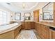 Luxurious bathroom featuring a soaking tub, double vanity, and marble countertops at 18 Club Ln, Littleton, CO 80123