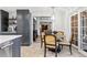 Charming dining area adjacent to the kitchen with elegant seating and abundant natural light at 18 Club Ln, Littleton, CO 80123