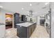 Well-equipped kitchen boasting stainless steel appliances, a center island, and ample counter space at 18 Club Ln, Littleton, CO 80123