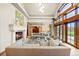 Elegant living room with stone fireplace and natural light at 18 Club Ln, Littleton, CO 80123