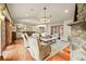Spacious living room with fireplace, bar area, and plush seating at 18 Club Ln, Littleton, CO 80123