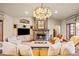 Inviting living room featuring a stone fireplace and built-in cabinetry at 18 Club Ln, Littleton, CO 80123