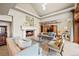 Cozy living room featuring a fireplace, comfortable seating, and a well-lit space at 18 Club Ln, Littleton, CO 80123