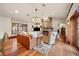 Bright living room with a cozy fireplace, wood floors, and comfortable seating at 18 Club Ln, Littleton, CO 80123