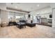 Spacious finished basement with a wet bar, large windows, and neutral decor at 8625 E 125Th Ct, Thornton, CO 80602