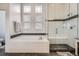 Modern bathroom with a soaking tub, glass-enclosed shower, and subway tile at 8625 E 125Th Ct, Thornton, CO 80602