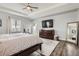 Bright bedroom with tray ceilings, wood floors, ample natural light and a walkout balcony at 8625 E 125Th Ct, Thornton, CO 80602