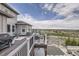 Relaxing deck area, showcasing outdoor seating, a grill, and scenic views of the surrounding landscape at 8625 E 125Th Ct, Thornton, CO 80602