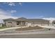 Charming home featuring stone accents, a three-car garage, and a meticulously landscaped front yard at 8625 E 125Th Ct, Thornton, CO 80602
