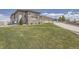 Manicured lawn, stone accents, and a pristine driveway enhance this property's curb appeal at 8625 E 125Th Ct, Thornton, CO 80602