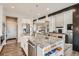 Spacious kitchen featuring a large island with granite countertops and stainless steel appliances at 8625 E 125Th Ct, Thornton, CO 80602