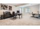 Functional home office with built-in desk, great natural light, and neutral carpet at 8625 E 125Th Ct, Thornton, CO 80602