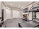 Finished workout room featuring exercise equipment and a mirrored wall at 8625 E 125Th Ct, Thornton, CO 80602