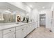 Bathroom boasts large vanity, dual sinks, tiled floor and walk-in closet at 3381 N Denali St, Aurora, CO 80019