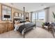 Bedroom featuring neutral walls, carpet, four poster bed, and bright windows at 3381 N Denali St, Aurora, CO 80019