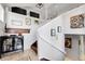Bright foyer featuring a staircase, tile flooring, and decorative artwork at 10991 Expedition, Littleton, CO 80125
