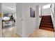 Entryway with a staircase and tile flooring leads to an office space featuring a large window at 10991 Expedition, Littleton, CO 80125