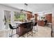 Open kitchen featuring a large center island, counter seating, stainless steel appliances, and lots of light at 10991 Expedition, Littleton, CO 80125