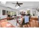 Spacious living room featuring hardwood floors, large windows, skylights and an open floor plan layout at 10991 Expedition, Littleton, CO 80125