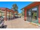 Patio with a hot tub, lounge seating, pergola, and a sliding glass door to the house at 10991 Expedition, Littleton, CO 80125