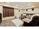 Finished basement featuring a cozy sitting area, a plush rug, and modern speakers at 7307 Pine Forest Ln, Parker, CO 80134