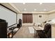 Finished basement features a home theater with a projector and comfortable seating area at 7307 Pine Forest Ln, Parker, CO 80134