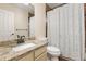 Bathroom with granite vanity countertop and patterned shower curtain at 7307 Pine Forest Ln, Parker, CO 80134
