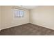 Bedroom featuring neutral paint, a window, and carpet flooring at 7307 Pine Forest Ln, Parker, CO 80134