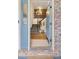 Inviting foyer featuring a stylish staircase, a chandelier, and an open view at 7307 Pine Forest Ln, Parker, CO 80134